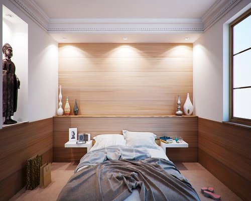 Bedroom with heavy blackout curtains in a modern apartment